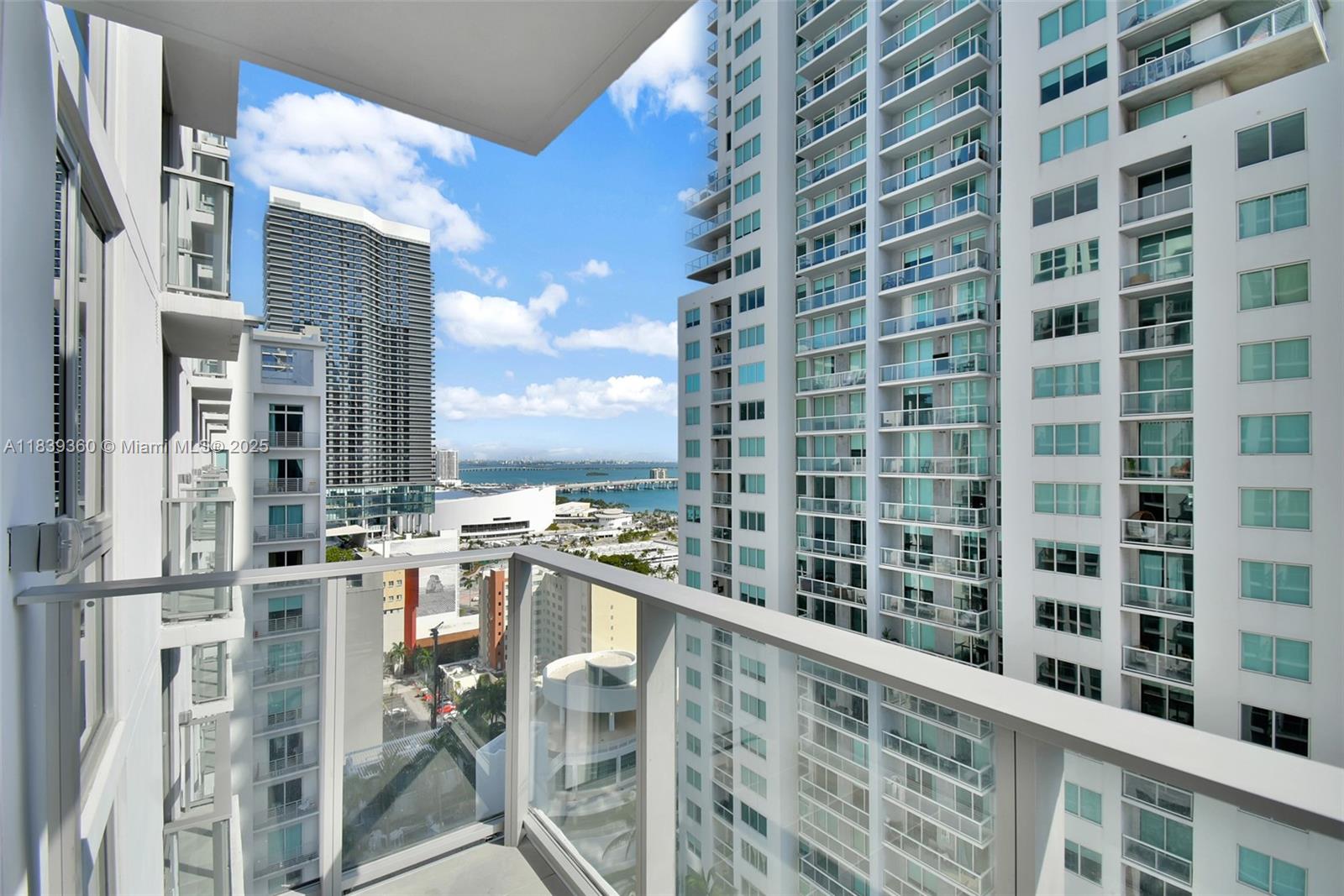227 Northeast 2nd Street, Unit 2000 Miami, FL 33132 - Photo 13 of 44 a view of a balcony with chairs