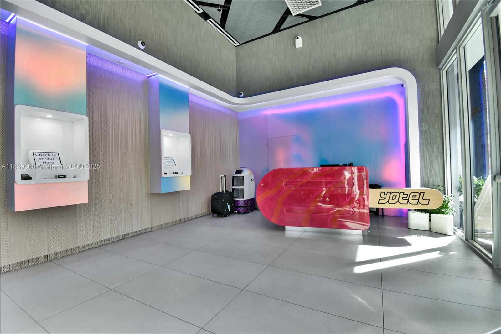 227 Northeast 2nd Street, Unit 2000 Miami, FL 33132 - Photo 32 of 44 a bedroom with a bed and window