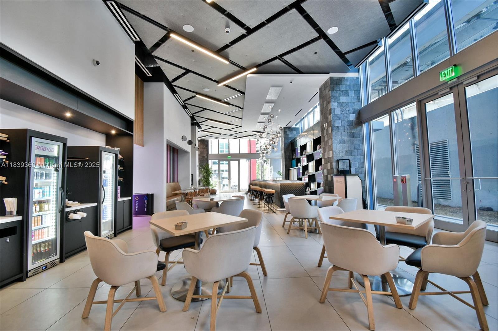 227 Northeast 2nd Street, Unit 2000 Miami, FL 33132 - Photo 34 of 44 a room with lots of furniture and wooden floor