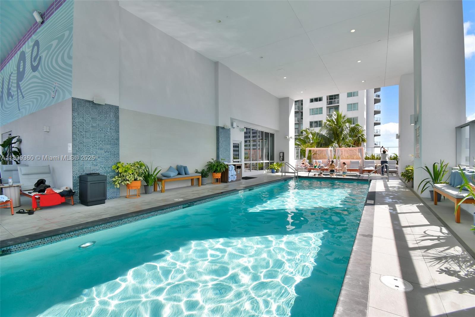 227 Northeast 2nd Street, Unit 2000 Miami, FL 33132 - Photo 38 of 44 a living room with furniture and a dining table