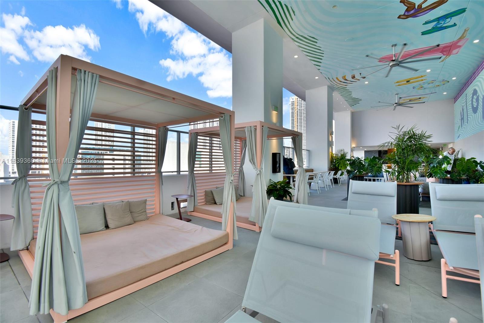 227 Northeast 2nd Street, Unit 2000 Miami, FL 33132 - Photo 39 of 44 a balcony with furniture and flowers