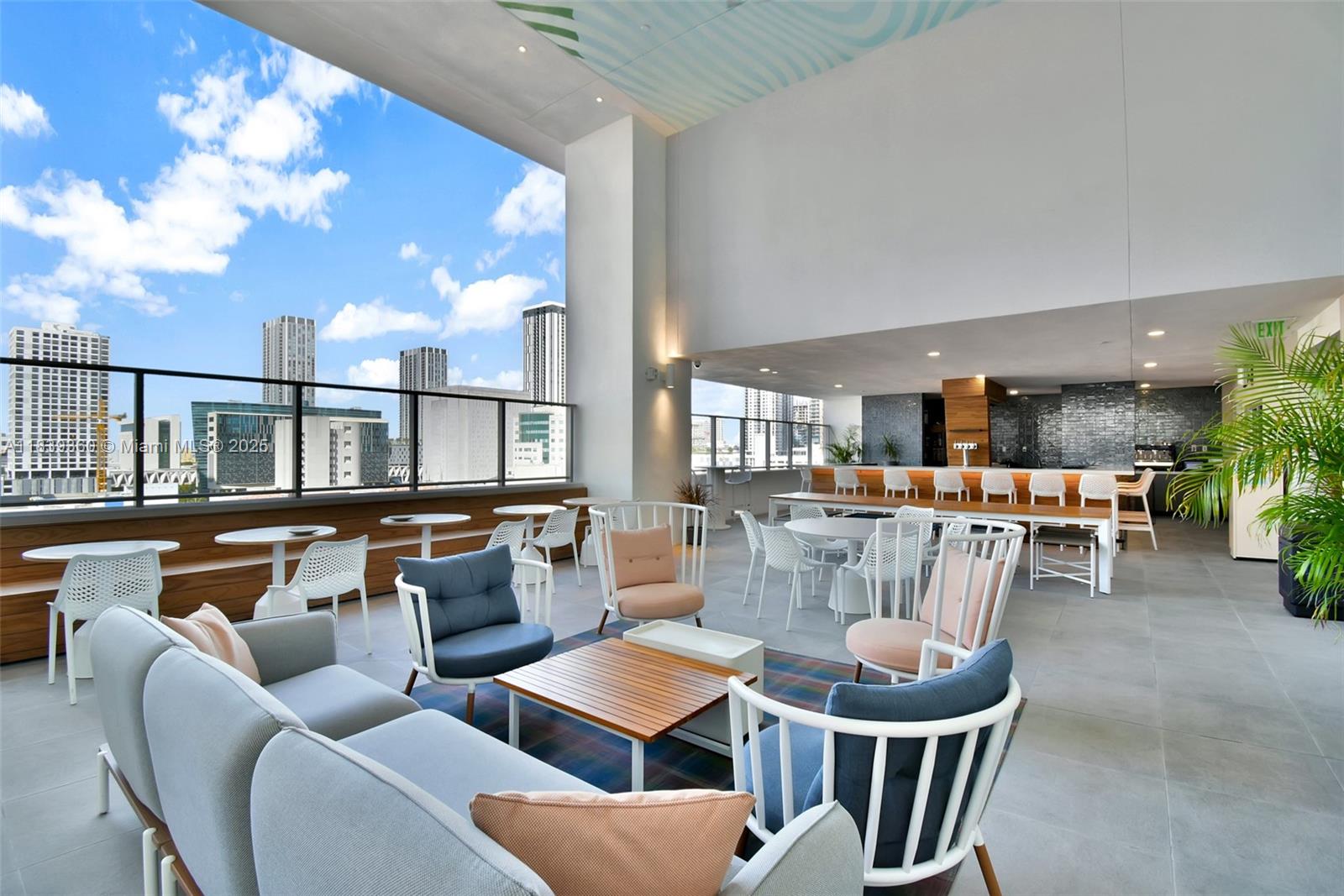 227 Northeast 2nd Street, Unit 2000 Miami, FL 33132 - Photo 40 of 44 a dining room with furniture a rug and a chandelier