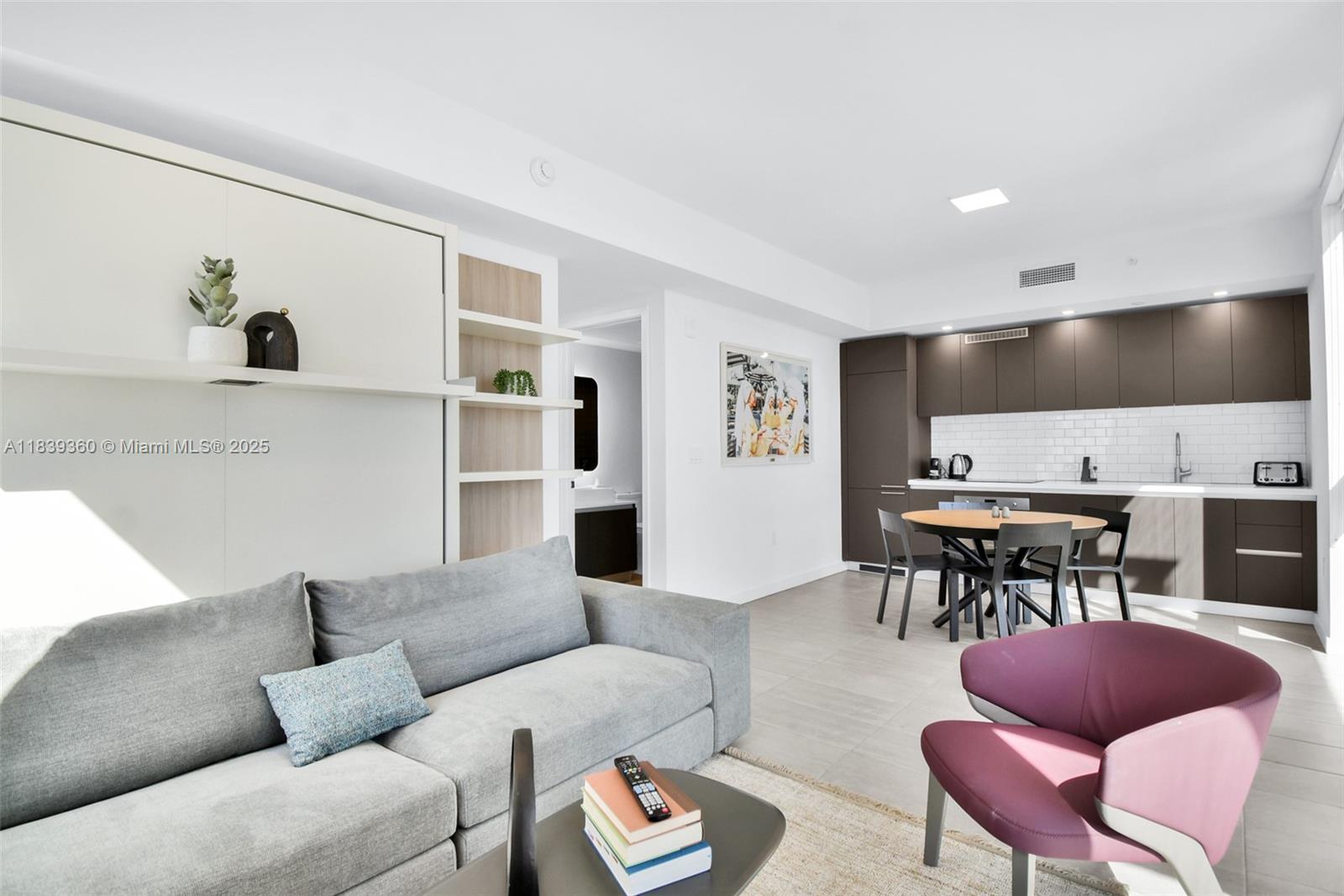 227 Northeast 2nd Street, Unit 2000 Miami, FL 33132 - Photo 5 of 44 a living room with furniture and view of kitchen