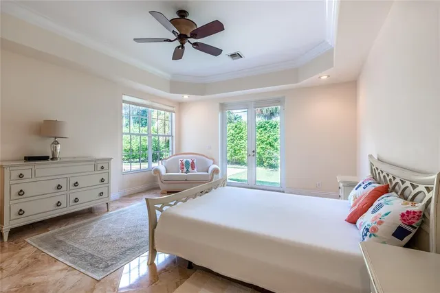 a bed room with a bed and a window