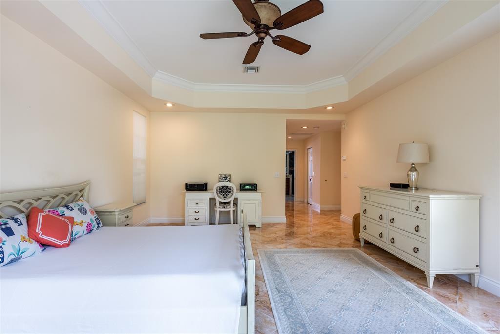 2999 Banyan Road Boca Raton, FL 33432 - Photo 18 of 38 a bedroom with furniture and natural light