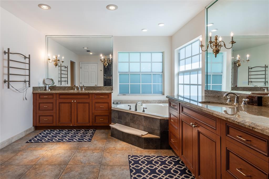 2999 Banyan Road Boca Raton, FL 33432 - Photo 21 of 38 a bathroom with a granite countertop double vanity sink a mirror a bathtub and window