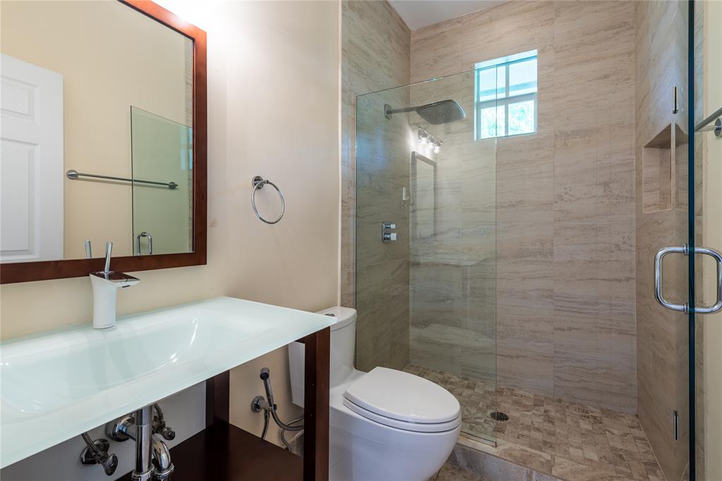 2999 Banyan Road Boca Raton, FL 33432 - Photo 24 of 38 a bathroom with a sink a toilet and shower
