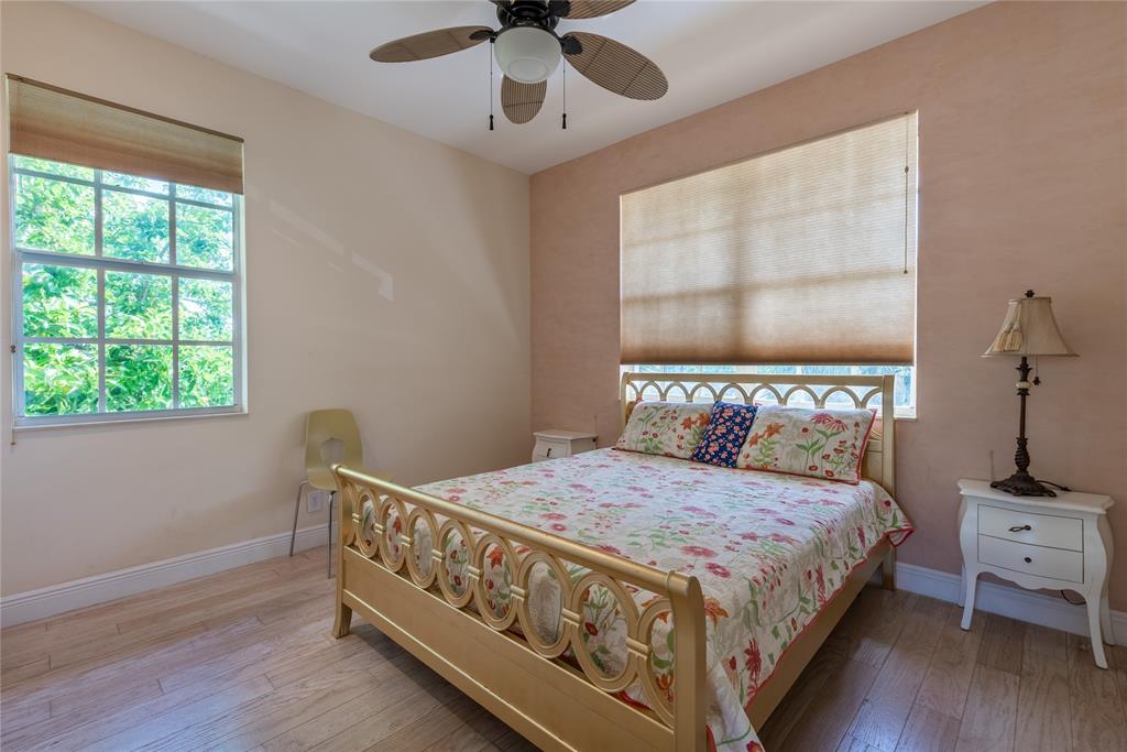 2999 Banyan Road Boca Raton, FL 33432 - Photo 25 of 38 a bedroom with a bed and a window