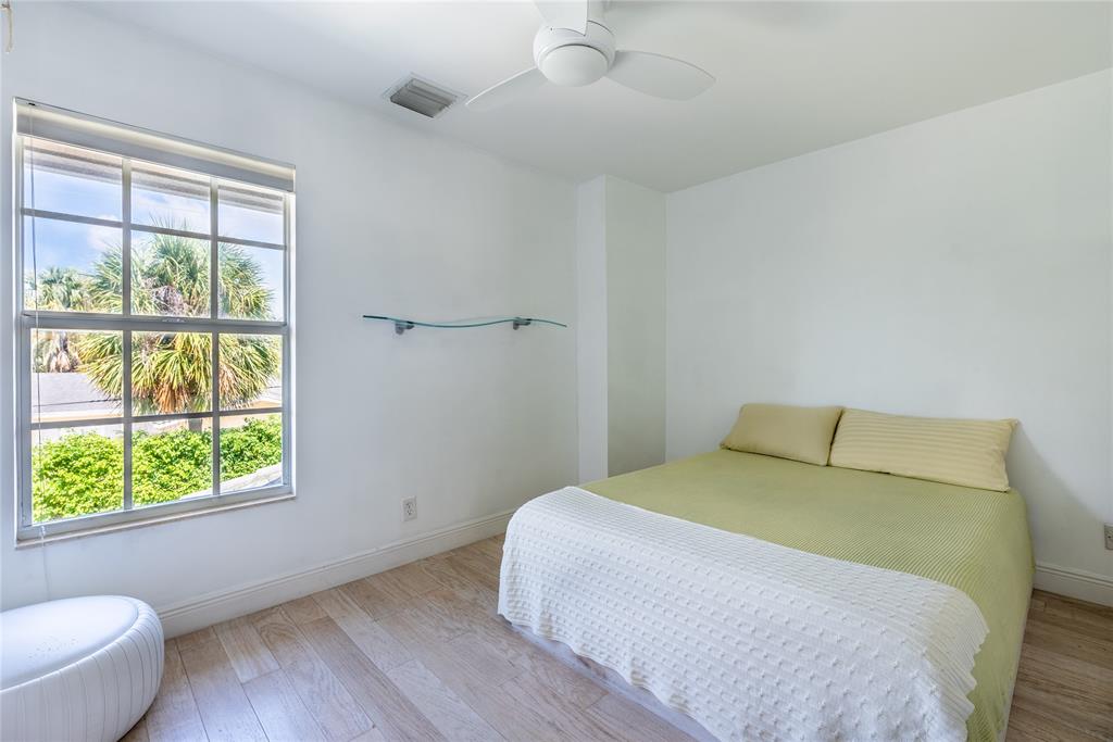 2999 Banyan Road Boca Raton, FL 33432 - Photo 27 of 38 a bedroom with a bed and a window