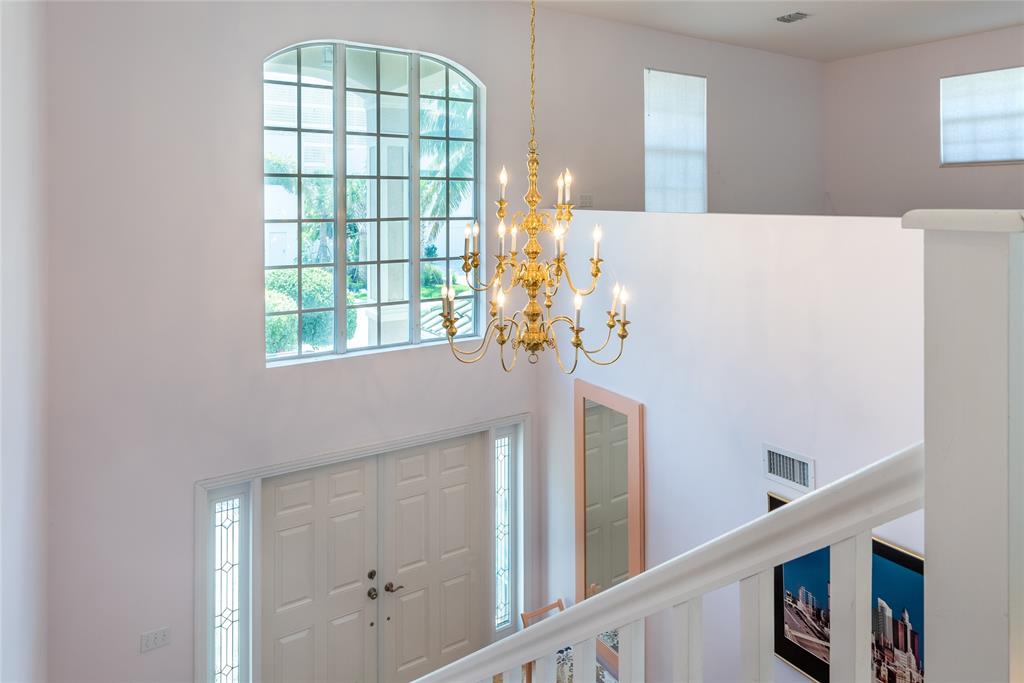 2999 Banyan Road Boca Raton, FL 33432 - Photo 30 of 38 a dining room with chandelier fan and wooden floor