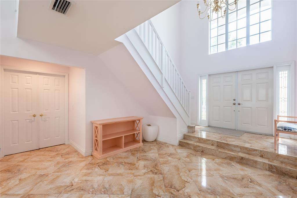 2999 Banyan Road Boca Raton, FL 33432 - Photo 5 of 38 a view of a livingroom with wooden floor and stairs
