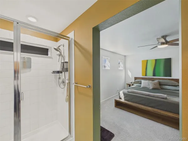 a en suite bathroom with a tub shower and sink