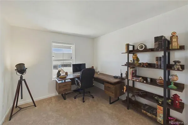 a room with furniture and a gym machine