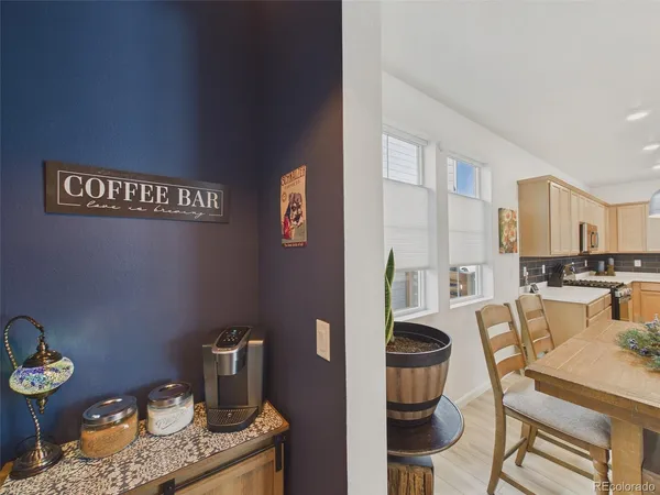 a view of a kitchen with dining table and chairs