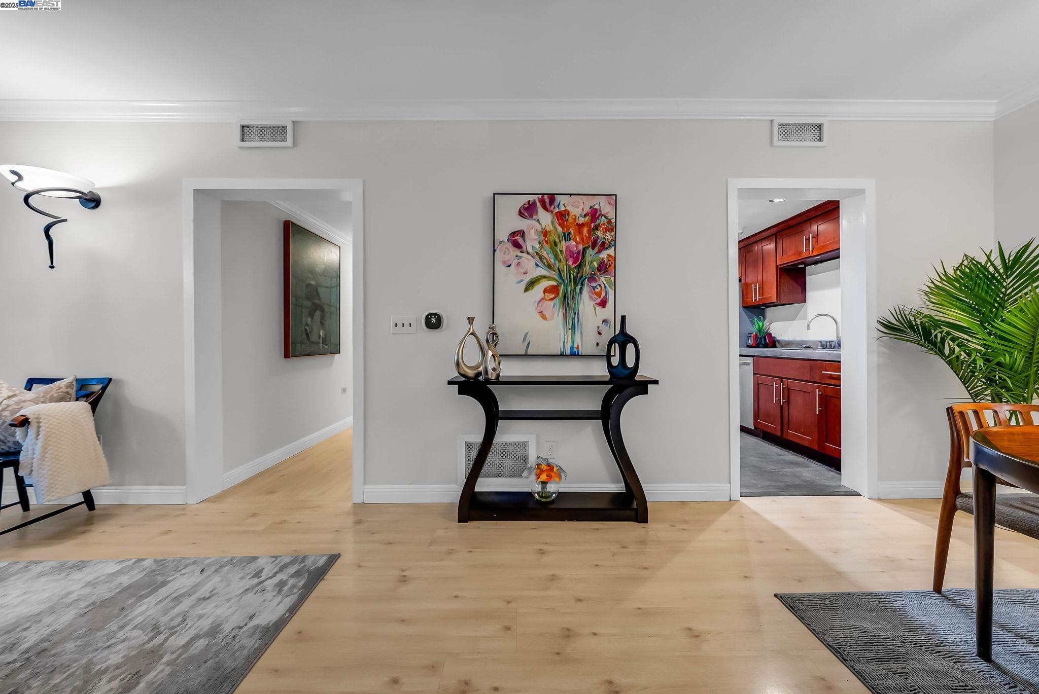 400 Wayne Avenue, Unit 1 Oakland, CA 94606 - Photo 13 of 37 a room with couch and painting on the wall