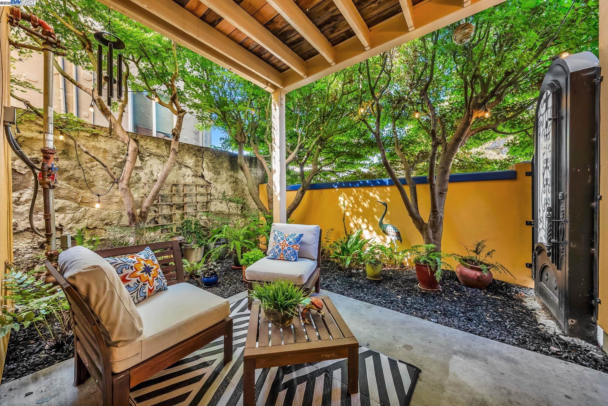 400 Wayne Avenue, Unit 1 Oakland, CA 94606 - Photo 2 of 37 a backyard of a house with outdoor seating