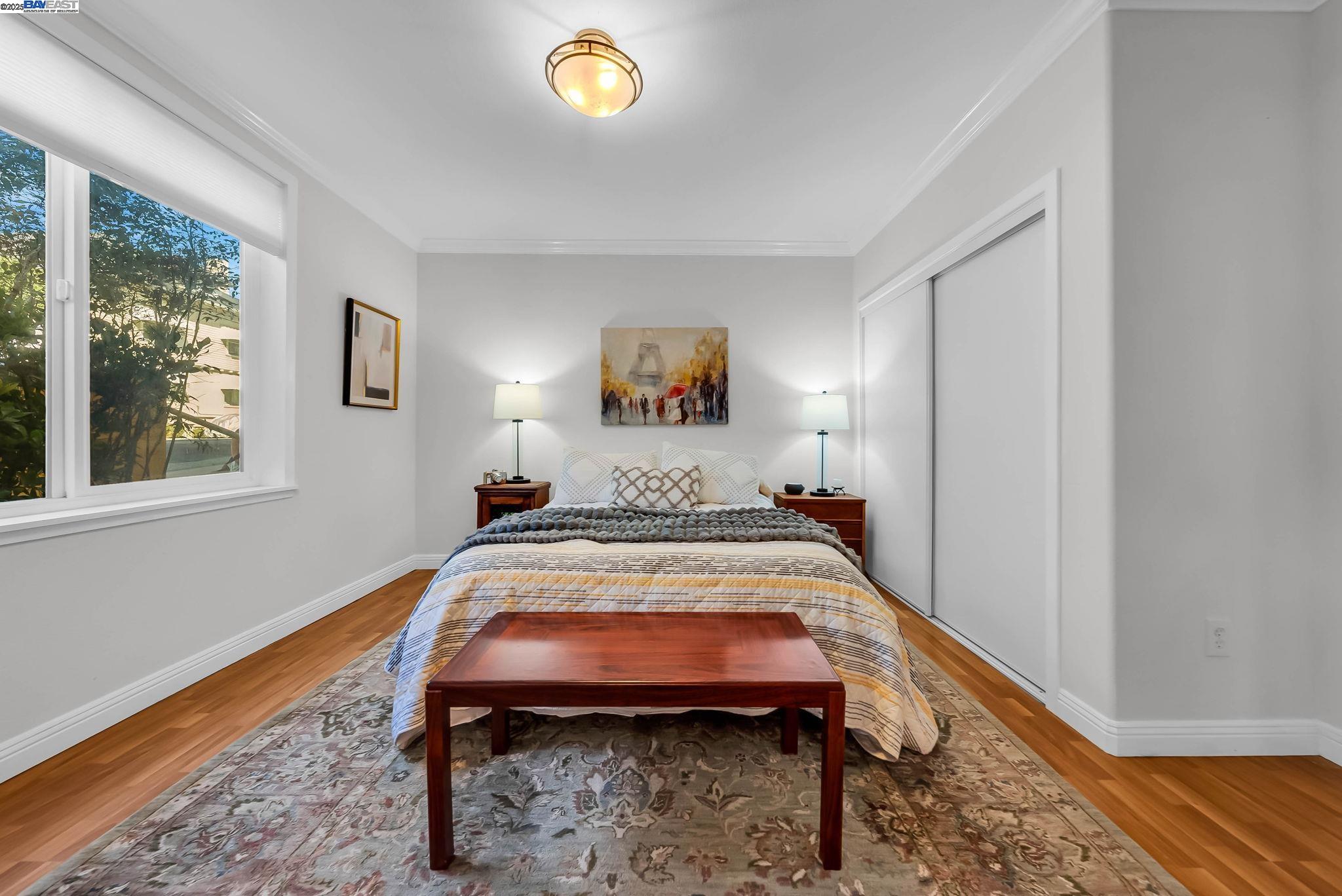 400 Wayne Avenue, Unit 1 Oakland, CA 94606 - Photo 25 of 37 a bed room with a bed and a window