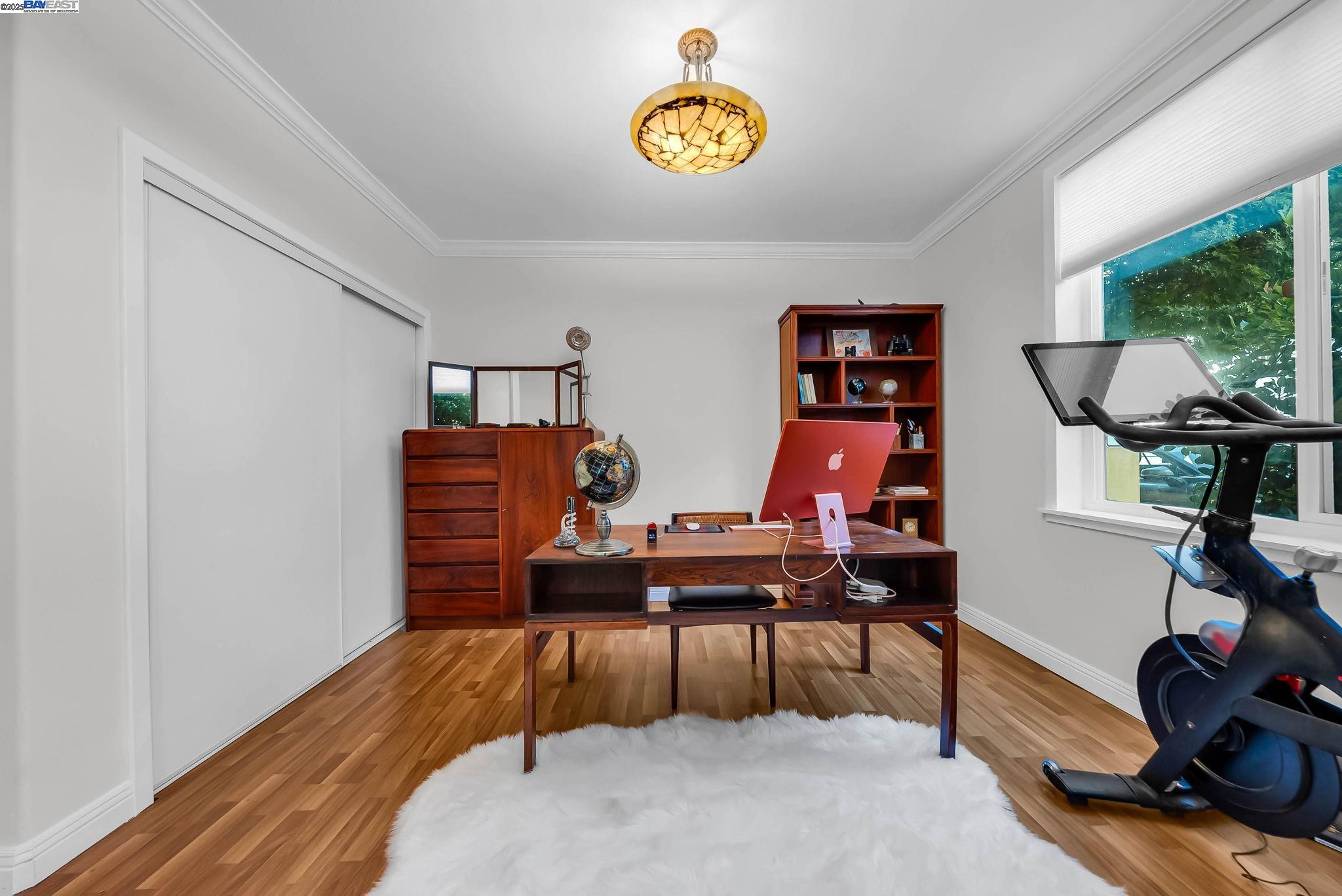 400 Wayne Avenue, Unit 1 Oakland, CA 94606 - Photo 28 of 37 a view of a workspace with furniture and a window