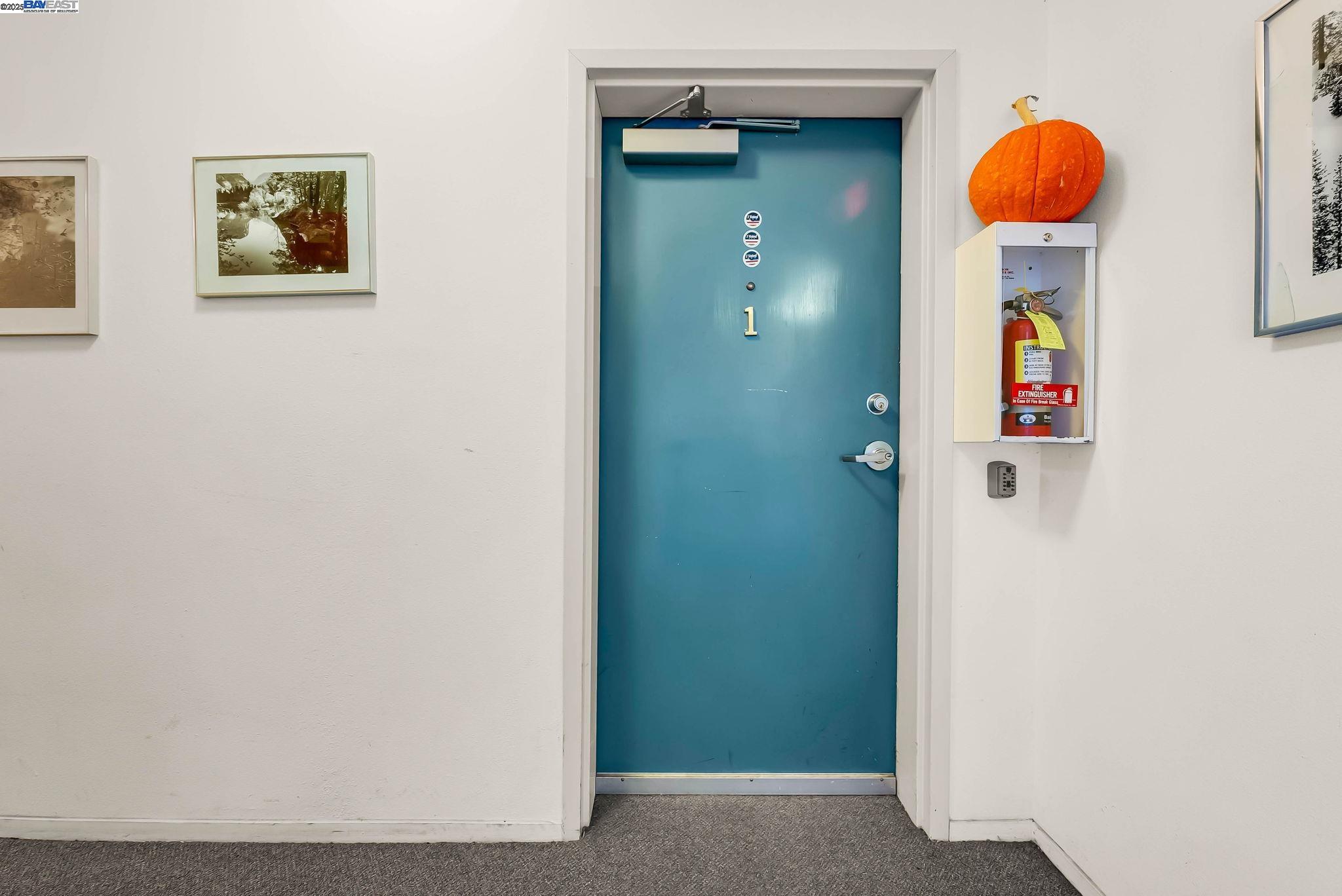 400 Wayne Avenue, Unit 1 Oakland, CA 94606 - Photo 33 of 37 a room that has a mirror and a table in it