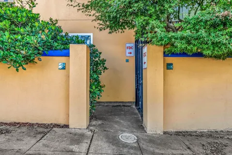a living room with furniture a rug and a flat screen tv