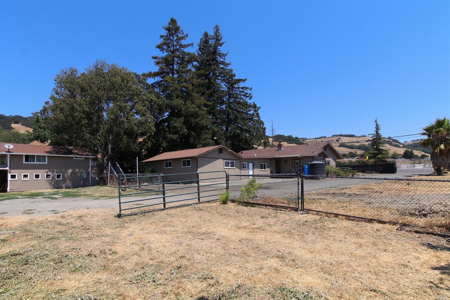 5465 Petaluma Hill Road Santa Rosa, CA 95404 - Photo 1 of 1 a view of a terrace with wooden fence