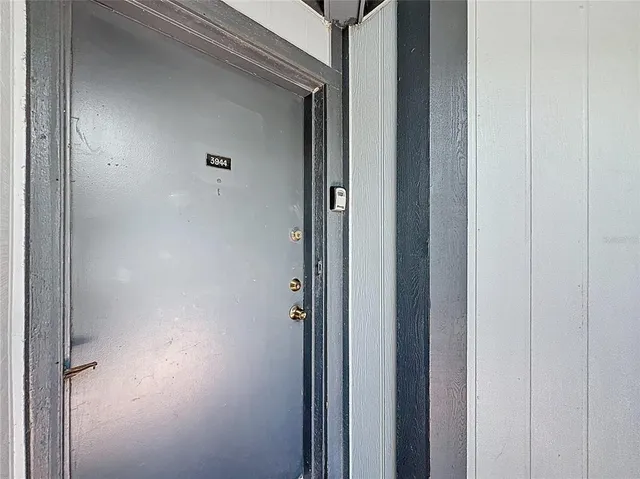 an aerial view of a house with a lake view