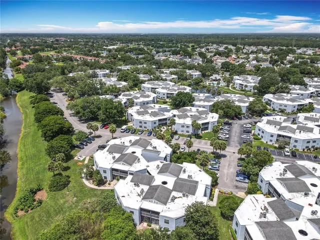 a bedroom with two beds and wooden floor