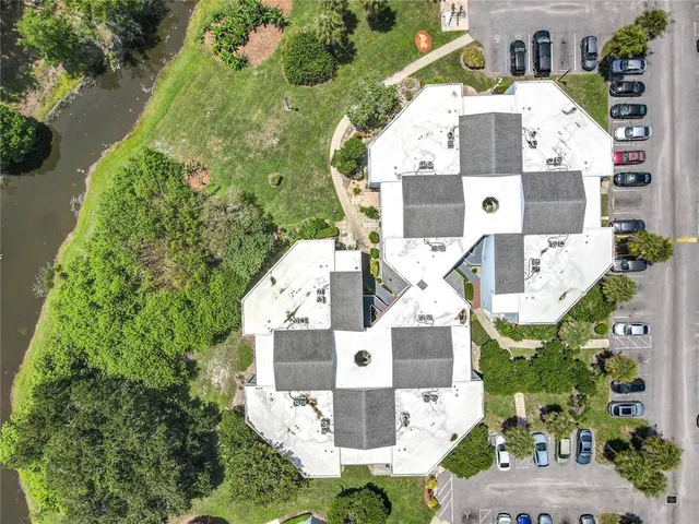 a bathroom with a granite countertop sink mirror and a bath tub