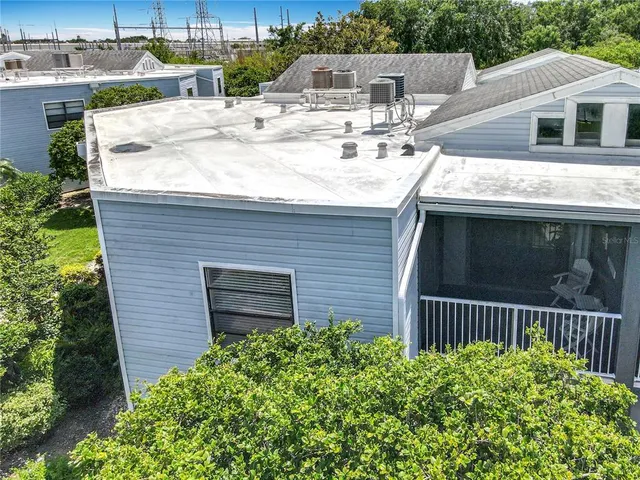 a bedroom with a bed and a night stand