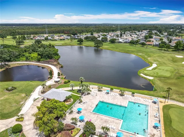 a view of a swimming pool and an outdoor seating