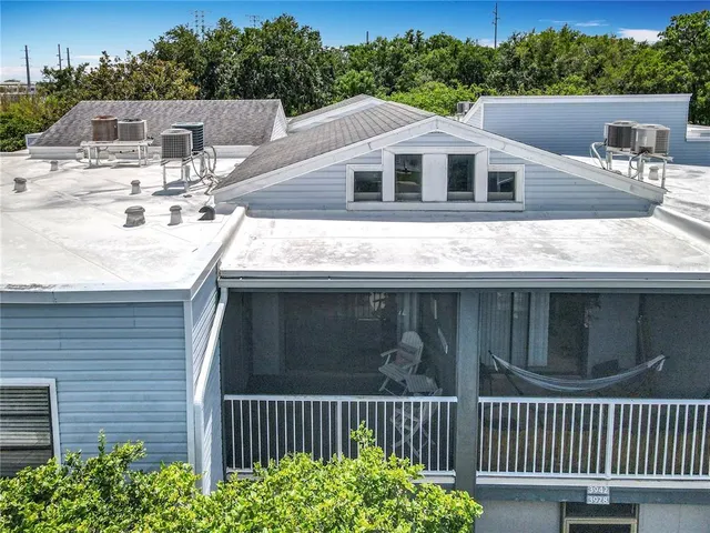 a bedroom with a bed a table and a bookshelf