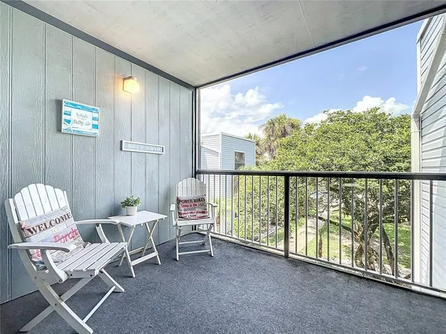 a bedroom with a bed and a night stand