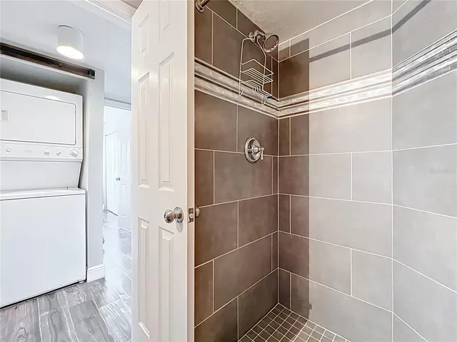 a kitchen with granite countertop cabinets stainless steel appliances and a sink