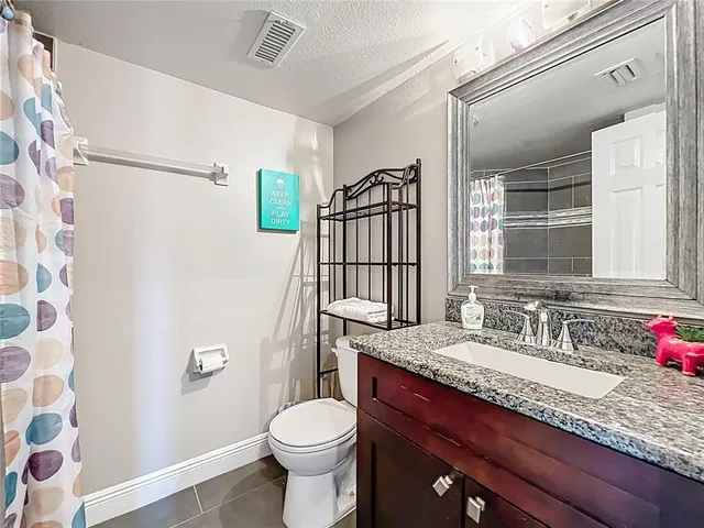a white refrigerator freezer sitting inside of a kitchen
