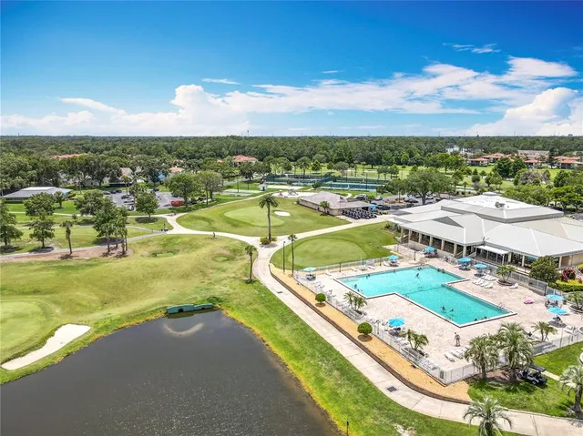a view of a lake with houses in the back