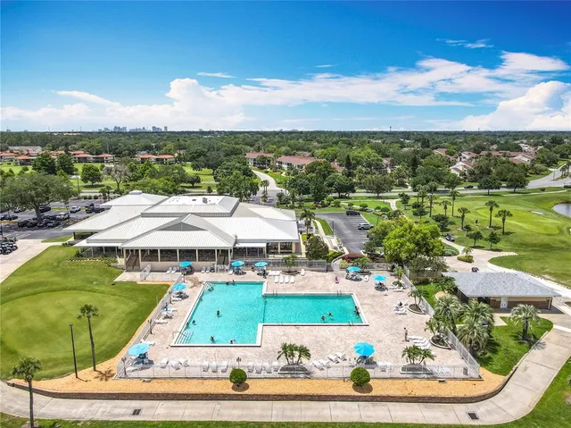 a view of a lake with houses in the background