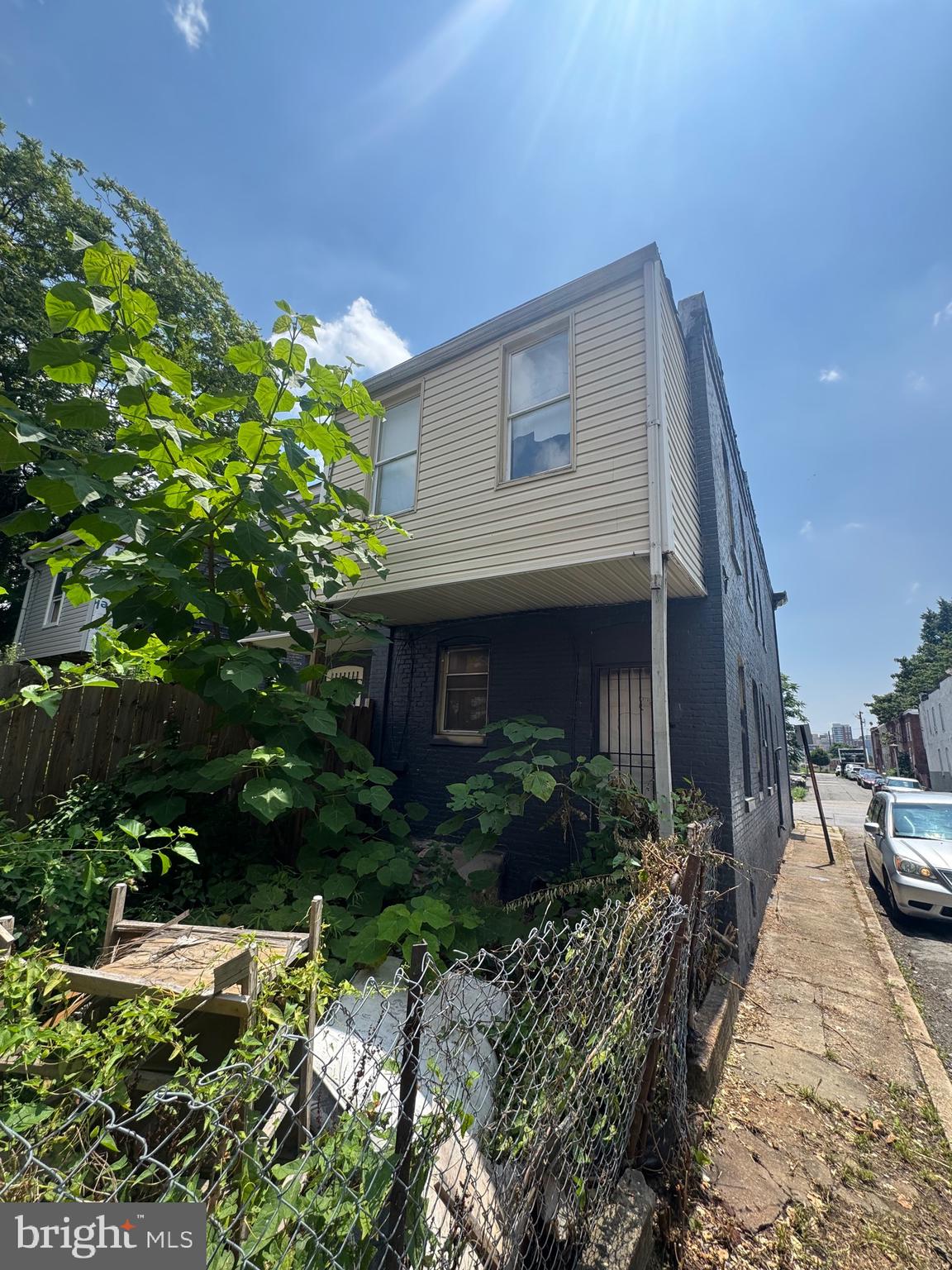 1908 Federal Street Baltimore, MD 21213 - Photo 17 of 18 a view of a house with a yard and plants