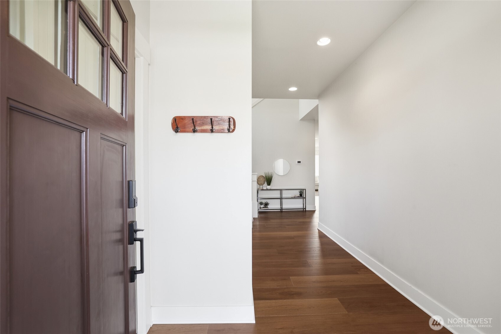 16927 35th Drive Southeast Bothell, WA 98012 - Photo 2 of 38 a view of a hallway with wooden floor and staircase