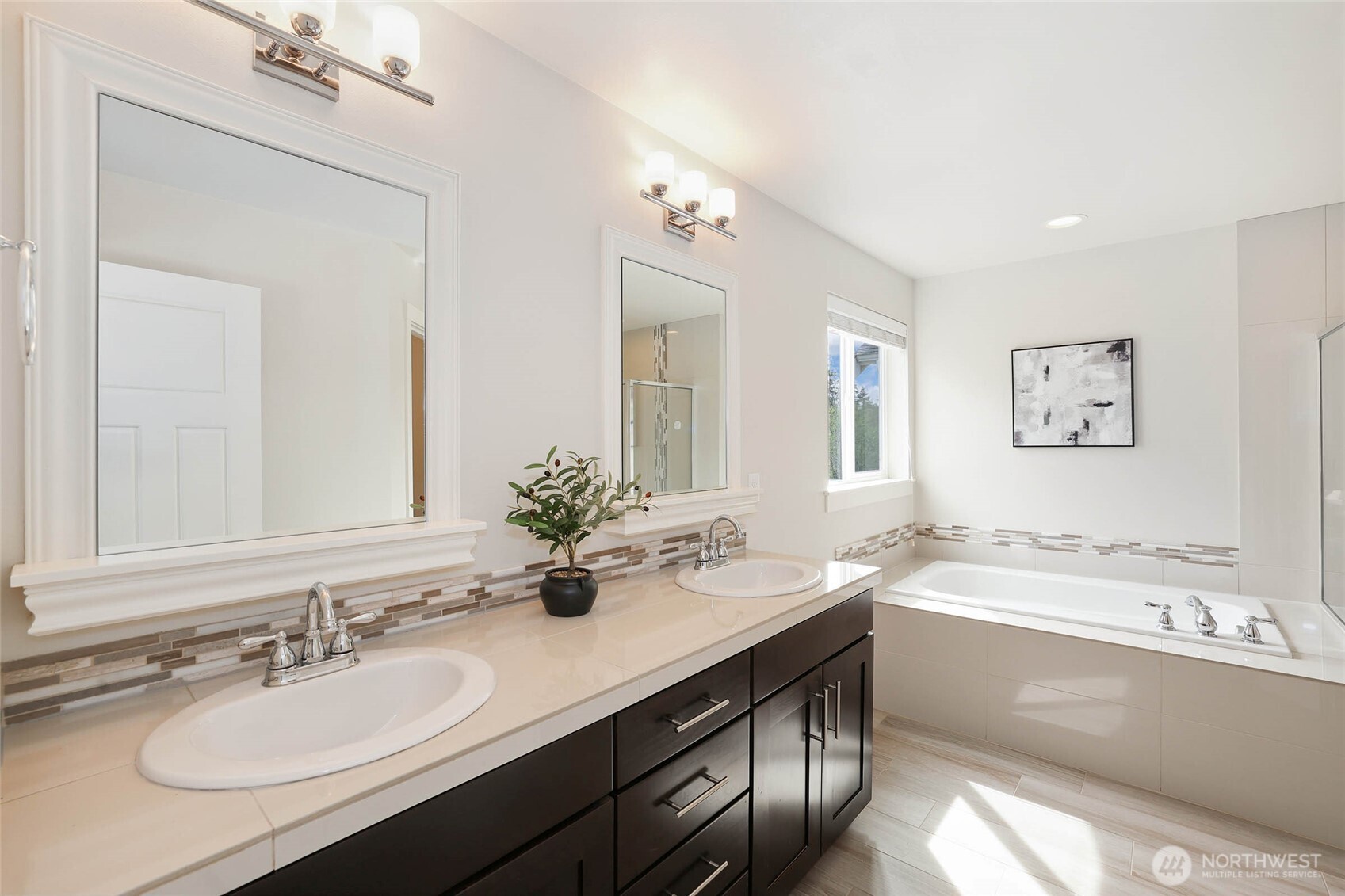 16927 35th Drive Southeast Bothell, WA 98012 - Photo 21 of 38 a bathroom with a sink double vanity granite tub and a mirror