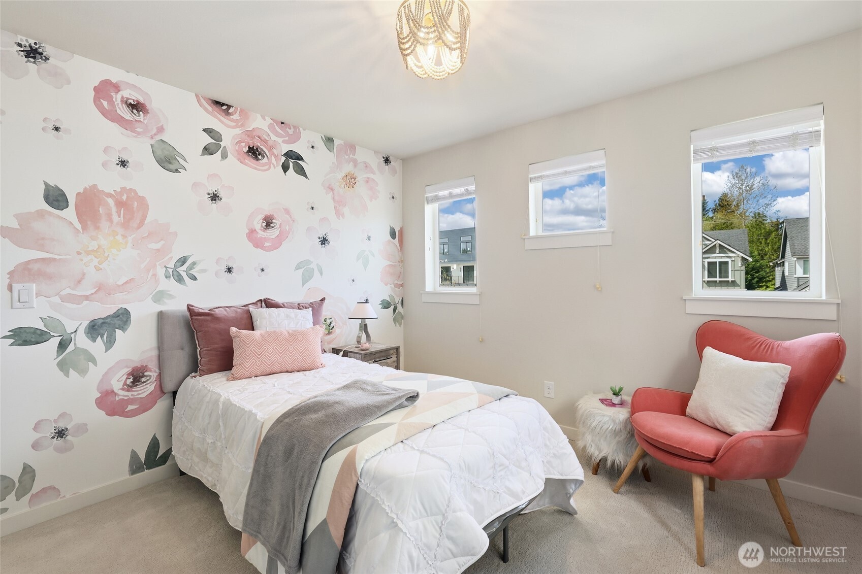 16927 35th Drive Southeast Bothell, WA 98012 - Photo 24 of 38 a bedroom with a bed and a chair with painting on the wall