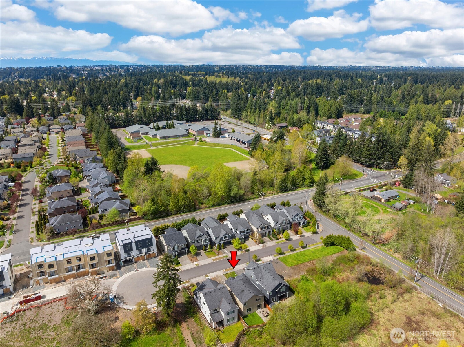 16927 35th Drive Southeast Bothell, WA 98012 - Photo 38 of 38 an aerial view of a house with a swimming pool yard and lake view
