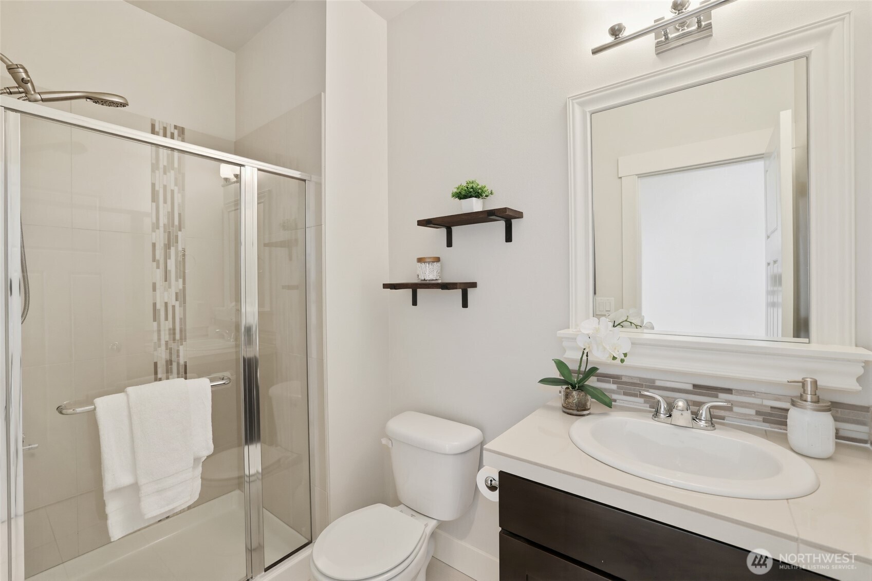 16927 35th Drive Southeast Bothell, WA 98012 - Photo 6 of 38 a bathroom with a sink vanity mirror and toilet