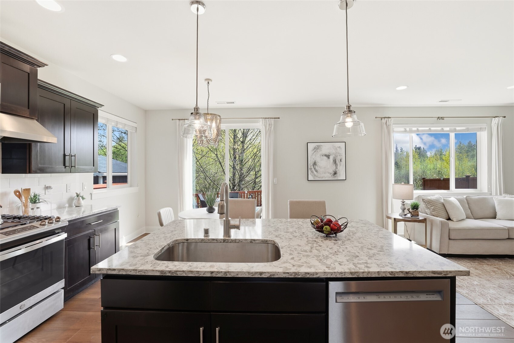 16927 35th Drive Southeast Bothell, WA 98012 - Photo 9 of 38 a kitchen with sink refrigerator and window