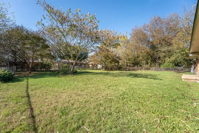 a view of outdoor space with deck and yard