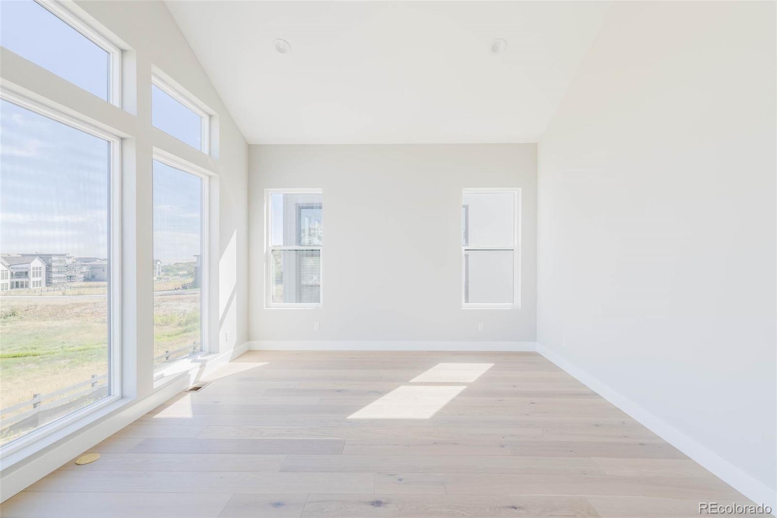 2233 Rim Ridge Drive Castle Pines, CO 80108 - Photo 20 of 40 a view of an empty room with a window