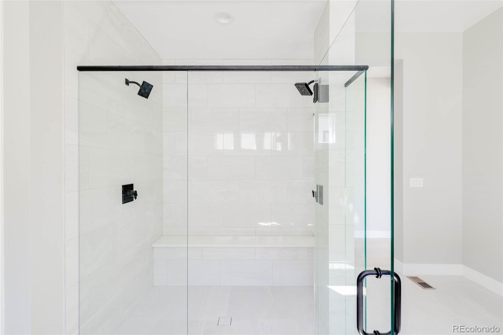 2233 Rim Ridge Drive Castle Pines, CO 80108 - Photo 24 of 40 a bathroom with a shower