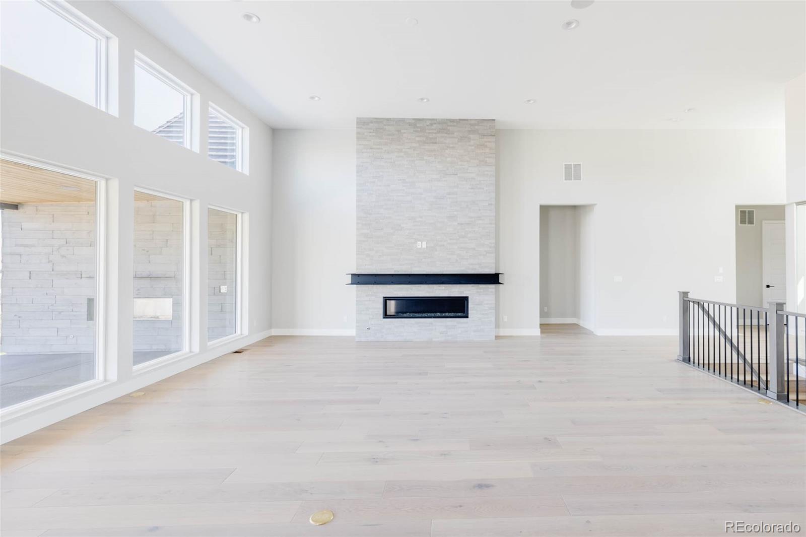 2233 Rim Ridge Drive Castle Pines, CO 80108 - Photo 10 of 40 a view of an empty room with a window