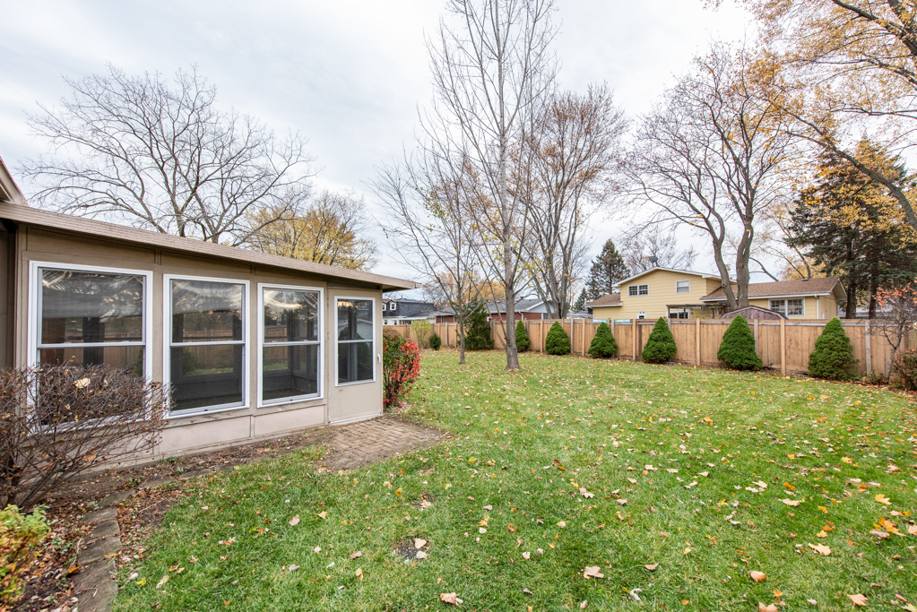 2313 Beck Road Lindenhurst, IL 60046 - Photo 28 of 35 a house with trees in front of it