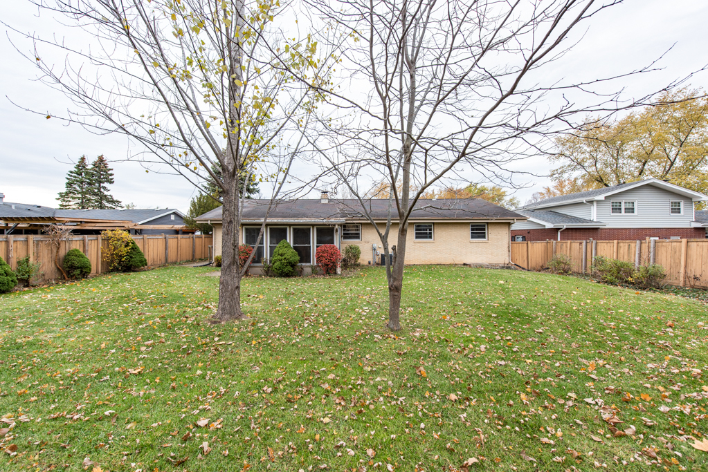 2313 Beck Road Lindenhurst, IL 60046 - Photo 30 of 35 a view of a yard in front of a house with large trees