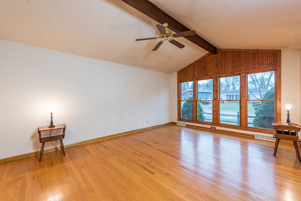 2313 Beck Road Lindenhurst, IL 60046 - Photo 4 of 35 a view of empty room with wooden floor and fan